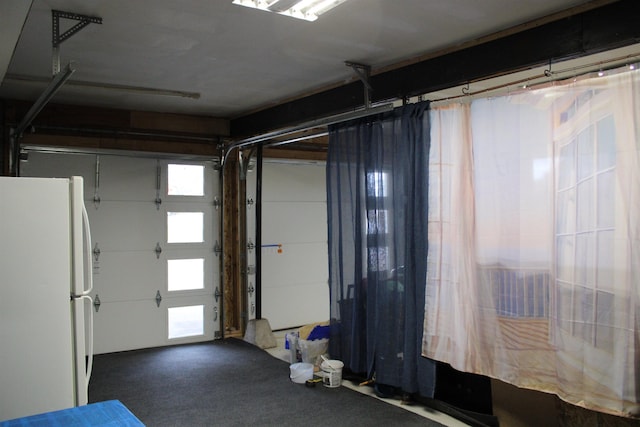 garage featuring white refrigerator