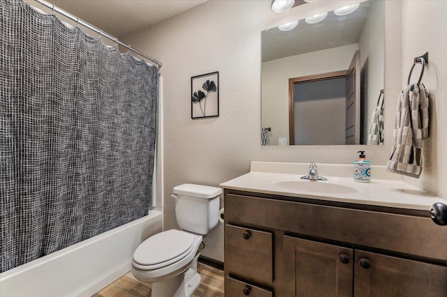 bathroom featuring hardwood / wood-style flooring, vanity, and toilet