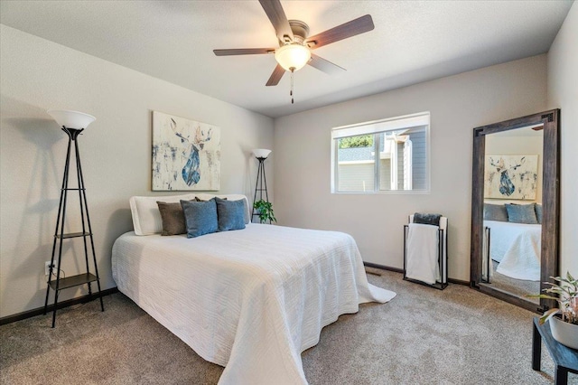 bedroom featuring ceiling fan and carpet floors