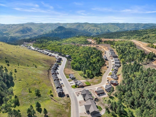 drone / aerial view featuring a mountain view