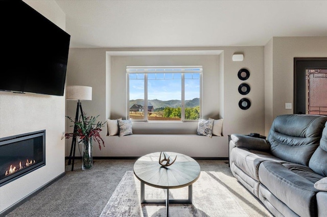 carpeted living room with a mountain view