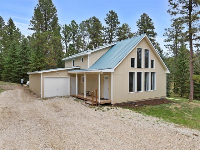 view of front of home with covered porch and a garage