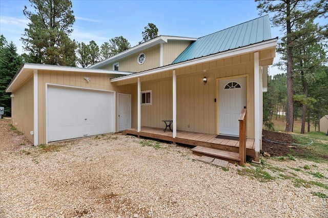 view of front of home with a garage and a wooden deck