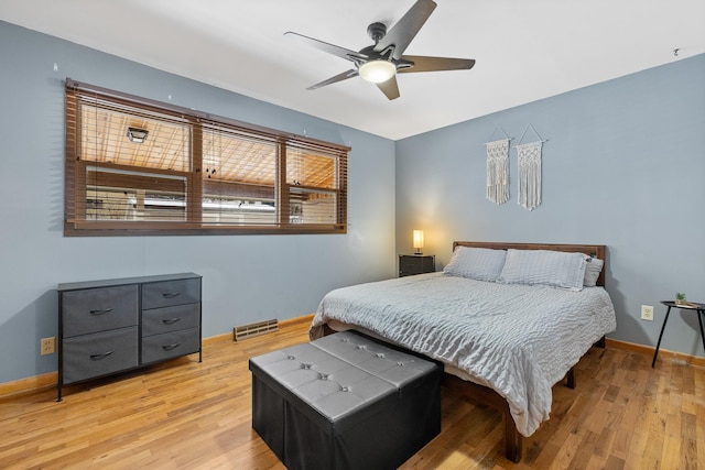 bedroom featuring light hardwood / wood-style floors and ceiling fan