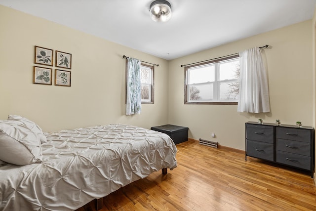 bedroom with hardwood / wood-style flooring