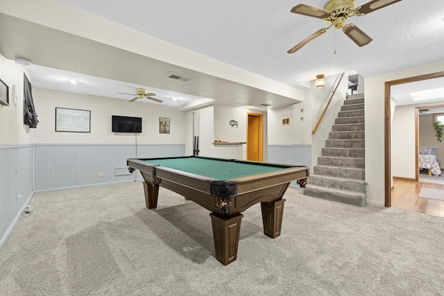 recreation room featuring ceiling fan, carpet, a textured ceiling, and billiards