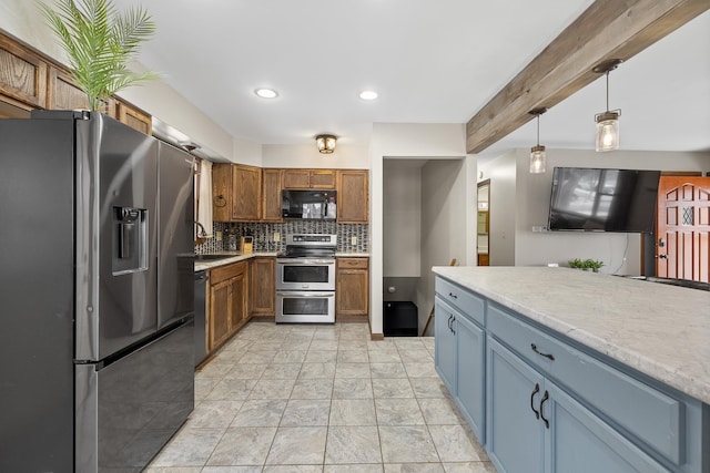 kitchen featuring black appliances, sink, hanging light fixtures, tasteful backsplash, and beam ceiling