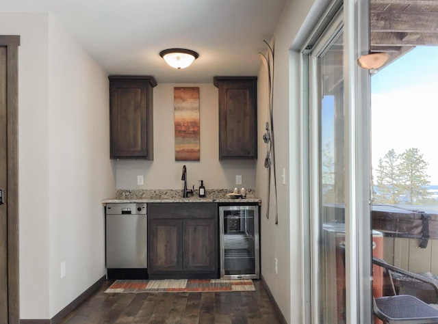 bar with dishwasher, dark brown cabinets, wine cooler, and a healthy amount of sunlight