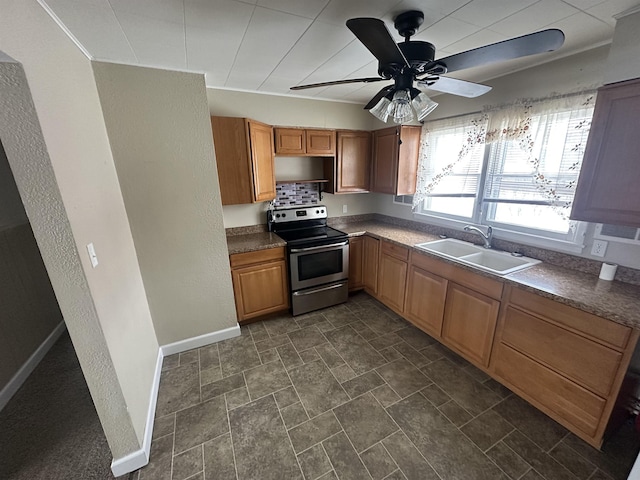 kitchen with ceiling fan, stainless steel range with electric stovetop, and sink