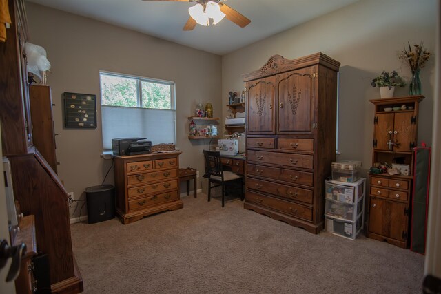 office area featuring ceiling fan and light colored carpet