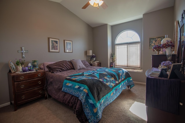 carpeted bedroom with ceiling fan and vaulted ceiling