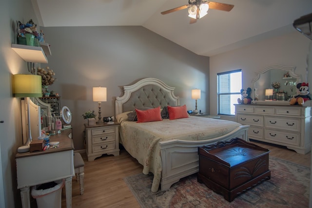 bedroom featuring ceiling fan, lofted ceiling, and hardwood / wood-style flooring