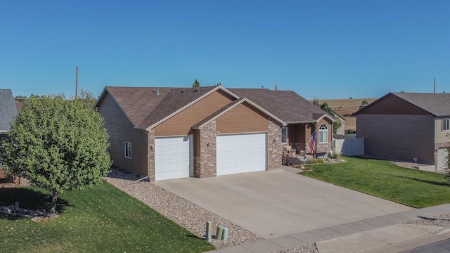 view of front of property with a front yard and a garage