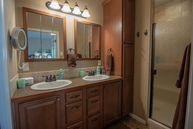 bathroom with vanity and an enclosed shower