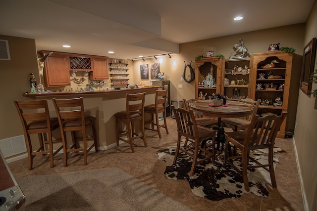 dining area featuring bar