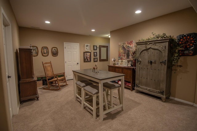 dining area with light colored carpet