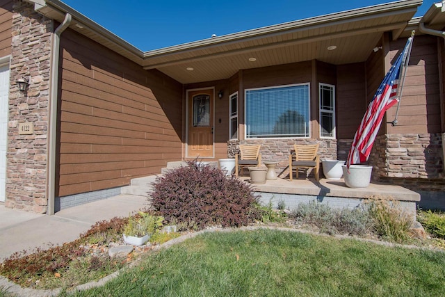 property entrance featuring a porch