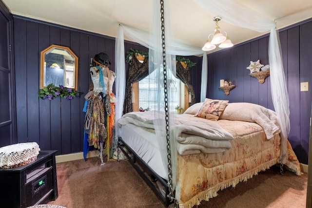 bedroom with carpet, an inviting chandelier, and wood walls