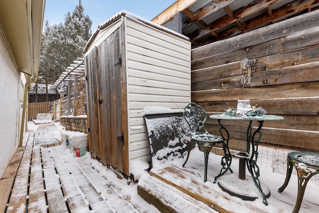 view of snow covered deck