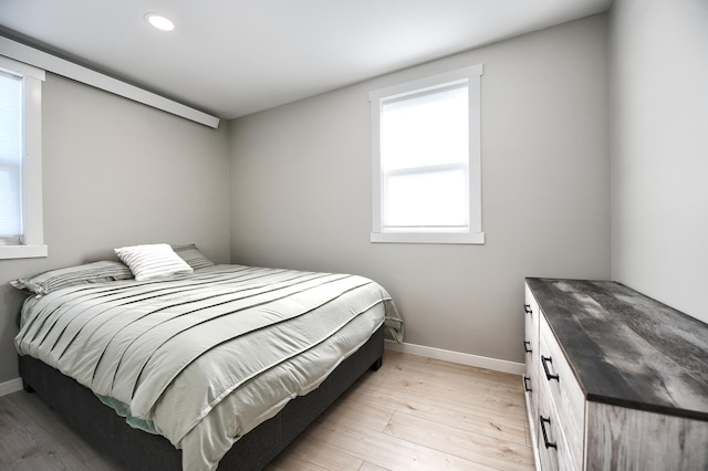 bedroom with light wood-type flooring