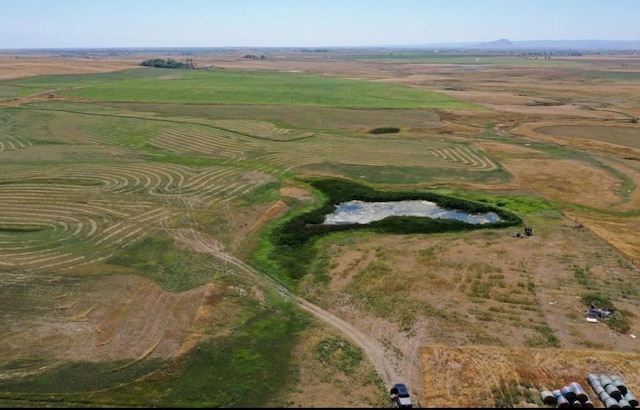 birds eye view of property with a rural view