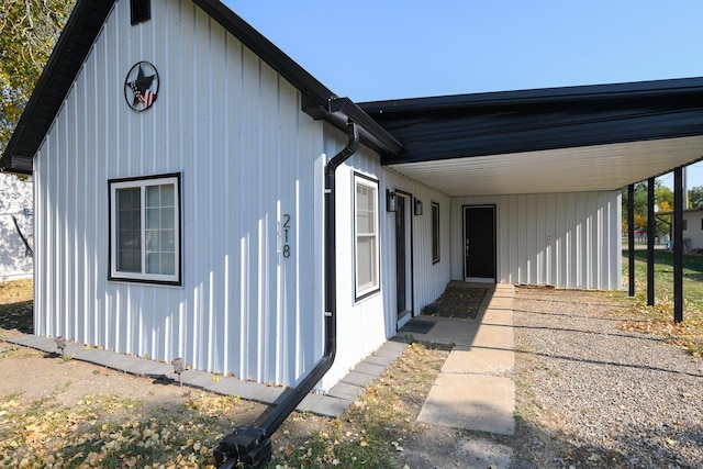 view of side of property with a carport