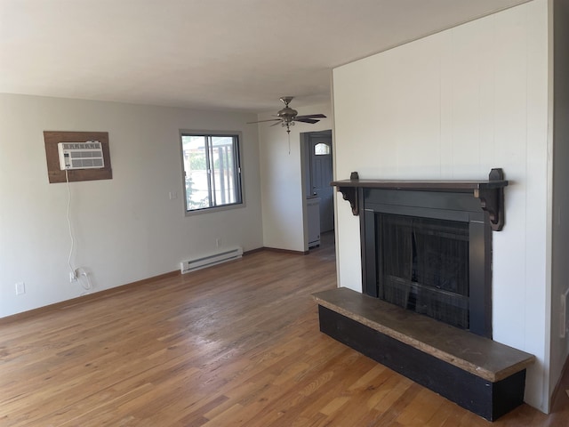 living room featuring a wall mounted AC, ceiling fan, hardwood / wood-style floors, and a baseboard radiator