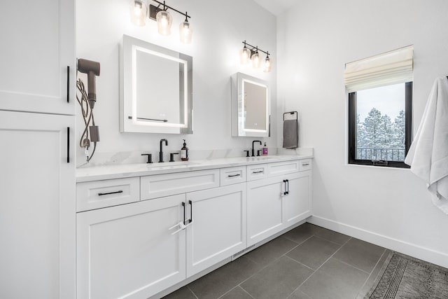 bathroom featuring tile patterned flooring and vanity