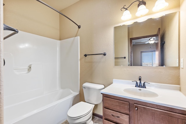 full bathroom featuring shower / bathing tub combination, vanity, ceiling fan, and toilet