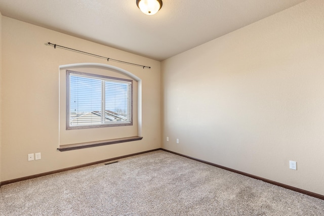 view of carpeted spare room