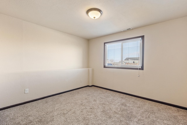 unfurnished room with carpet floors