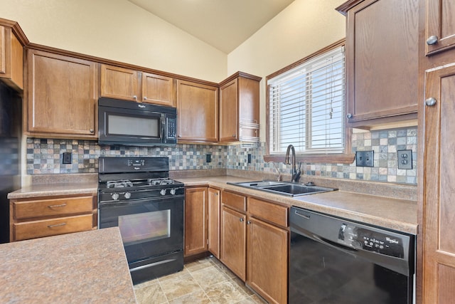 kitchen featuring sink, backsplash, vaulted ceiling, and black appliances