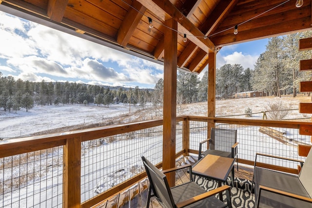 view of snow covered deck