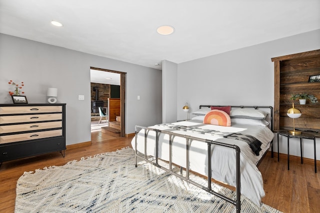 bedroom with hardwood / wood-style flooring