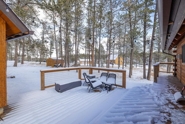 view of snow covered deck