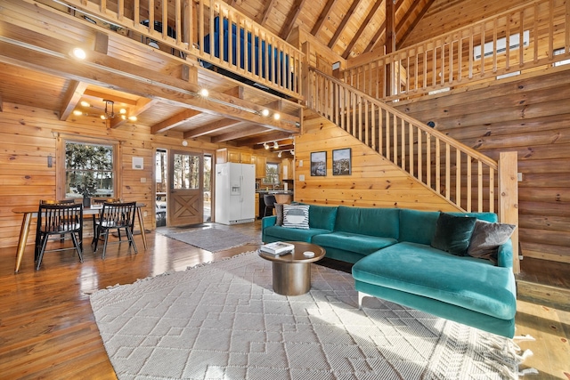 living room with hardwood / wood-style floors, beam ceiling, wood ceiling, and high vaulted ceiling