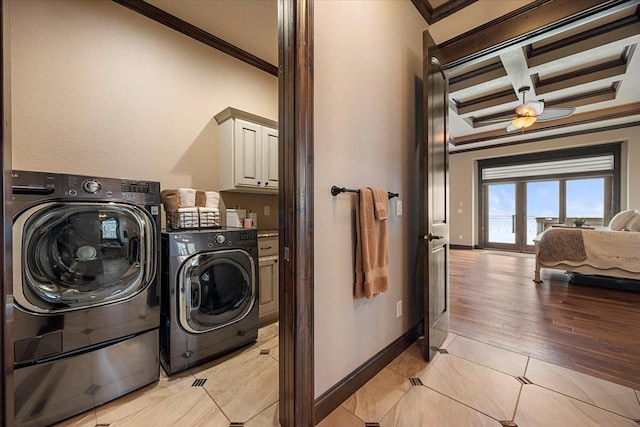 laundry room featuring independent washer and dryer, light tile patterned flooring, cabinets, and ornamental molding