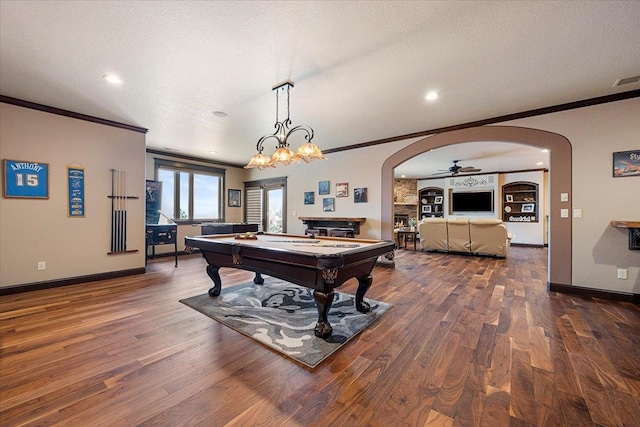 game room with ceiling fan, dark hardwood / wood-style flooring, a textured ceiling, and billiards