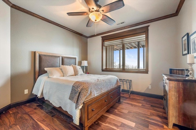 bedroom featuring dark hardwood / wood-style flooring, ceiling fan, and ornamental molding