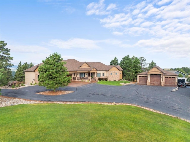 ranch-style home with a front lawn and a garage