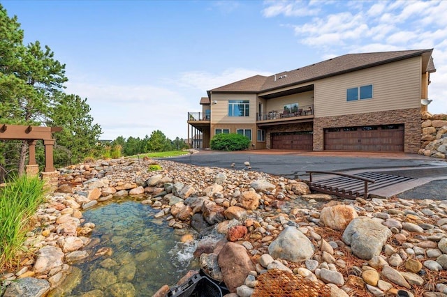 back of property featuring a garage