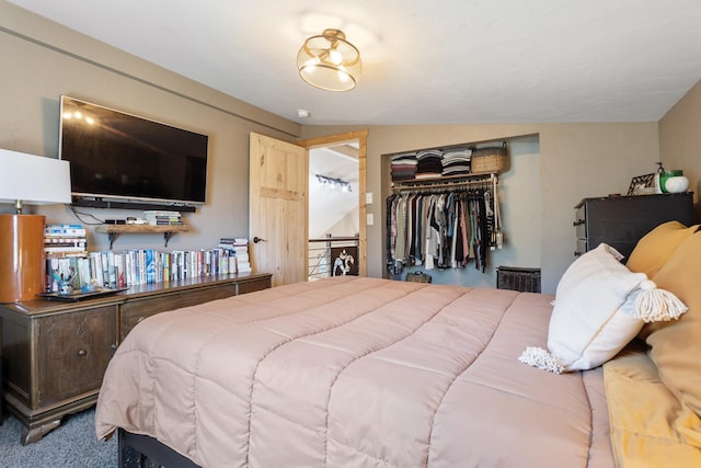 carpeted bedroom featuring a closet and lofted ceiling