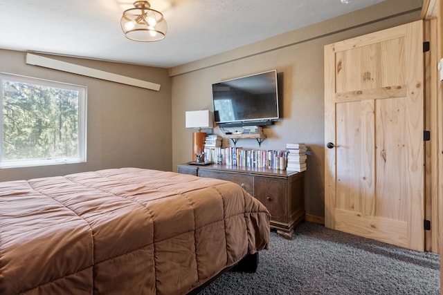 carpeted bedroom featuring lofted ceiling