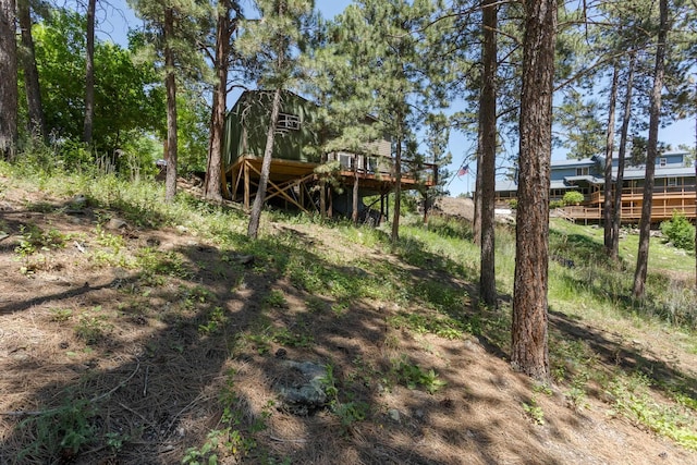 view of yard featuring a wooden deck