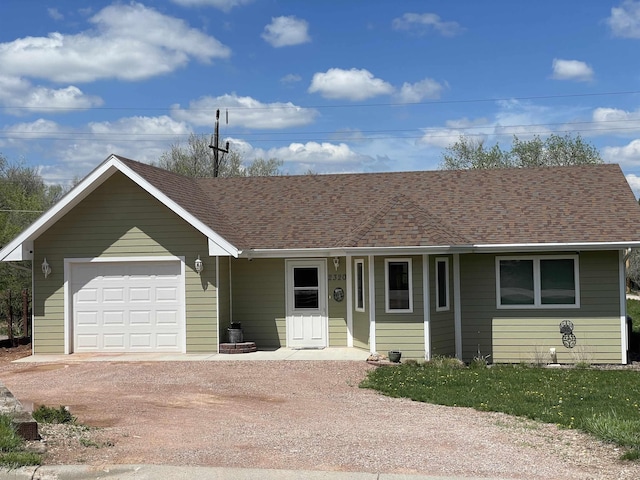 ranch-style house featuring a garage