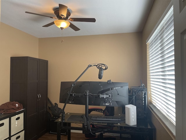 misc room featuring hardwood / wood-style flooring and ceiling fan