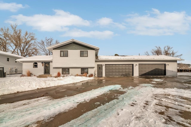 split level home with a garage