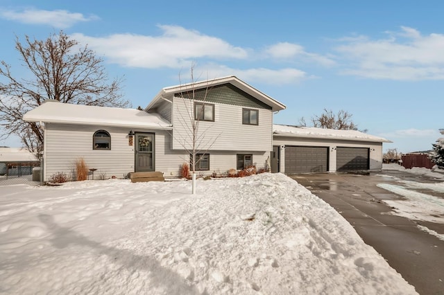 split level home featuring a garage