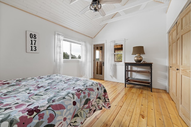 bedroom with lofted ceiling with beams, ceiling fan, light wood finished floors, and wood ceiling