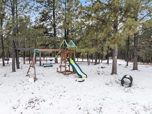 snow covered playground featuring playground community